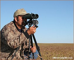 Guide Joe Rodriguez of Pusch Ridge Outfitters using Big Eyes to glass for speed goats on New Mexico's prairie.